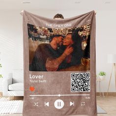 an image of a couple hugging each other on a brown blanket with the text, lover taylor swift