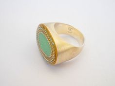 "Large oval boho ring. Gold & silver statement ring. Ming green bohemian ring. Unique resin ring. This large gold & silver ring has a modern, fashionable design. It will keep your look sparkly and stylish. Great for everyday wear, and will be a stunning addition to any evening dress. With this impressive ring, you are sure to make a statement. Fabulous gift any woman who likes unique, eye-catching jewelry. This boho ring is Hilawelner original design. Made of sterling silver and finished Bohemian Green Wedding Rings, Bohemian Sterling Silver Emerald Ring, Handmade Bohemian Emerald Open Ring, Bohemian Handmade Open Emerald Ring, Handmade Green Bohemian Ring, Bohemian Green Open Ring, Adjustable Green Bohemian Rings, Bohemian Green Sterling Silver Rings, Green Bohemian Sterling Silver Rings