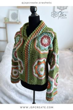 a crocheted jacket is on a mannequin