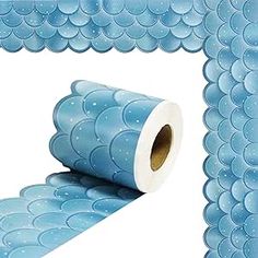 a roll of blue bubble wrapper sitting on top of a white floor next to a wall