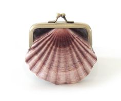 A seashell print features on this original velvet coin purse. Printed velvet front, Scottish linen back and dupion silk lining. Topped with an antiqued brass frame. Perfect for carrying small items, coins, jewellery etc. **Please note this size doesn't fit credit cards** Optional upgrade at checkout for gift box with customised name. + top width is 3 inches, bottom of purse 3.5 inches, height 3 inches + in cm: top width is 7.5cm, bottom of purse 9cm, height 7.5cm + original printed velvet front Mermaid Purse, Antique Brass Frame, Seashell Print, Velvet Purse, Purse Frame, Printed Velvet, Dupion Silk, Shell Jewelry, Jewelry Dish