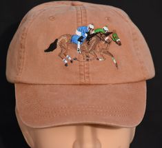 Horse Racing Embroidered hat. Share the laughter and spirit of friends.  The hat shown is the Terra Cotta at $24.95. Terra Cotta is pictured in the listing. I make these and have them ready to ship as Terra Cotta is the most popular hat color for this design. I am happy to "make to order" for other colors. You may choose a color from the drop down AND select your specific color from the Adams product sheet in the listing.  Pick your color Adams Baseball Hat with 2 horses and 2 riders racing beau 2 Horses, Popular Hats, The Adams, Horse Race, Embroidered Cap, Embroidered Hat, Embroidered Caps, Brass Buckle, Digital Embroidery