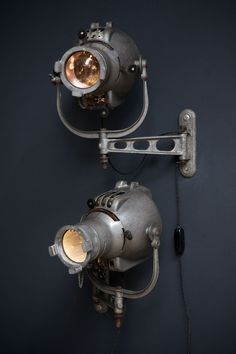 two industrial style lights are on the wall