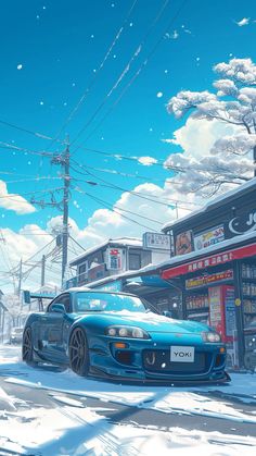 a blue sports car parked in front of a store on a snow covered city street