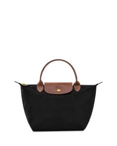 In a miniature size, Longchamp's signature nylon tote lends sophisticated style to every look. The lightweight design folds up for ease during travel. Nylon Handbag, Top Handle Handbags, Nylon Tote, Navy Gold, Longchamp Le Pliage, Folded Up, Black Handbags, Small Tops, Sophisticated Style