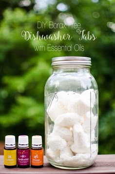 diy box free dishwasher tabs with essential oils in mason jar on wooden table