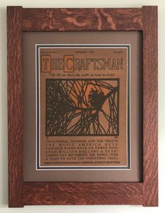 the craftsman's manual is displayed in a wooden frame with a black and brown border