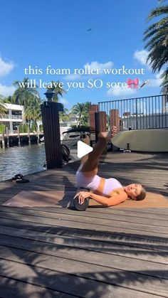 a woman is doing yoga on the dock