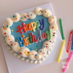 a heart shaped birthday cake with the words happy birthday written in frosting on it