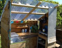 an outdoor kitchen made out of pallets