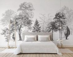 a bedroom with a large mural on the wall and wood flooring in front of it