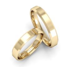 two yellow gold wedding rings on a white background