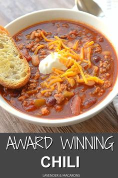 a bowl of chili with bread on the side and text reading award winning chilli