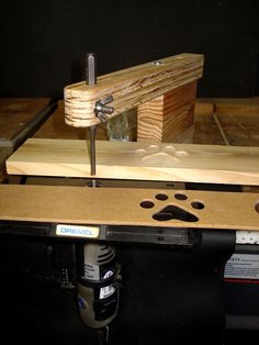 a piece of wood being worked on with a drill