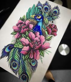 a peacock and flowers tattoo design on a sheet of paper