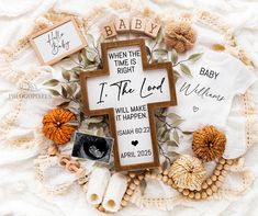 a wooden cross surrounded by other items on top of a white cloth covered blanket with the words, baby, when the night is the lord will make it happen to happen