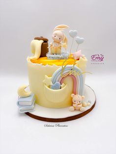 a cake that is on top of a white plate and has an image of a baby's birth