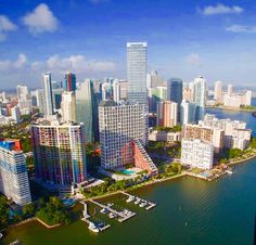 an aerial view of the city skyline and water in miami, florida with skyscrapers on both sides