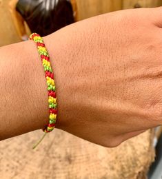 a person's arm with a colorful bracelet on it