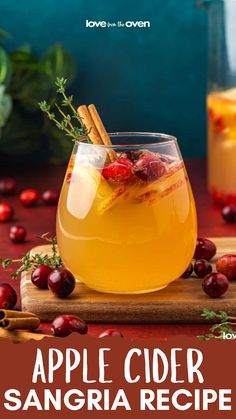 an apple cider sangria recipe in a glass with cinnamon stick garnish