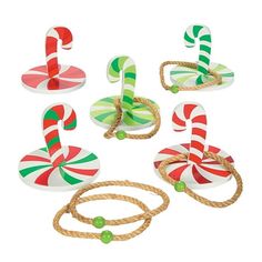 candy canes are tied to ropes on white background