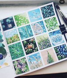 an open notebook with pictures of plants and watercolors on the pages next to a pen