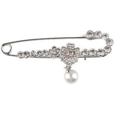 a brooch pin with pearls and crystals on it's back, in silver tone