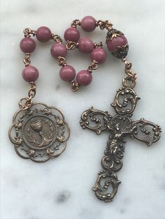 Beautiful First Communion pocket rosary. 6 and 8mm Rhodonite Gemstones 20 gauge solid bronze wire Bronze Medals Bronze Rosary As Gift, Bronze Rosary With Round Beads As Gift, Antique Jewelry With 8mm Beads For Gift, Antique 8mm Beads Jewelry As Gift, Antique Jewelry With 8mm Beads As Gift, Antique Handmade Rosary As Gift, Vintage Bronze Rosary As Gift, Antique 8mm Beads For Jewelry Making, Saint Agatha