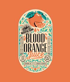 the label for blood orange juice, with an orange and green leaf design on it