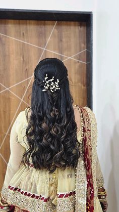 the back of a woman's head wearing a bridal hair piece