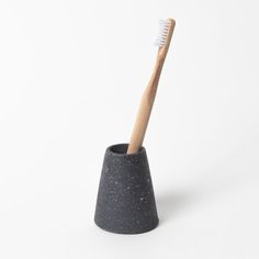 A more elegant and minimalist way to hold your toothbrush. Easily holds 1-2 standard size toothbrushes. Each holder is individually hand cast from custom-made rubber molds and sourced from recycled materials. Natural voids occur during casting, resulting in very small pin holes in some pieces. Pair tooth brush holder with soap dish with any of the Jao Soaps to make a useful gift. Size:2.5"W x 3"H Care:Do not submerge in water. Wipe clean with mild soap and water. Made in Houston, TX Concrete Work, Black Terrazzo, Toothbrush Holders, Mini Soaps, Small Pin, Skin Care Kit, Soap Gift, Body Brushing, Brush Holder