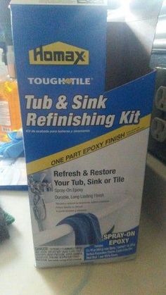 a box of tub and sink refinishing kit sitting on a counter next to other items