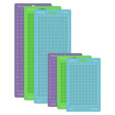 three cutting mats are shown in purple, green and blue