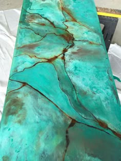 a table that has some kind of green marble on it