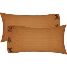 two brown pillows with stars on them