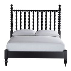 a black bed frame with white sheets and pillows on top of it, in front of a white background