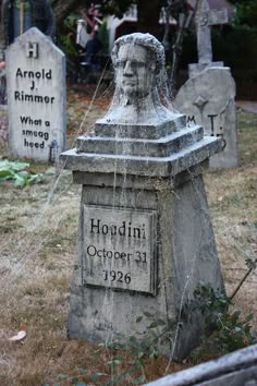 an old cemetery with graves and headstones in the grass, one has a veil on it's head