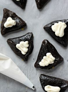 chocolate triangles with white frosting on top