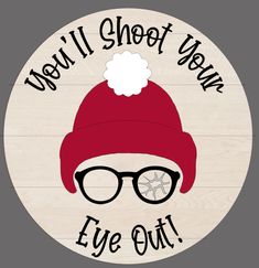 a wooden sign that says we'll shoot your eye out with a santa hat and glasses on it