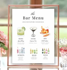 the bar menu is displayed on a table with flowers and vases in front of it