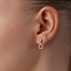 14K Gold Star Earrings complement a refined sense of style flawlessly. With their minimalist design, they exude a sense of simplicity and grace. Minimal Star Earrings effortlessly blend with any outfit, elevating every moment with a touch of sophistication. Crafted with utmost care, Star Dangle Earrings are made from 14K gold, guaranteeing quality and durability. Tiny Star Earrrings are carefully designed to withstand the test of time, ensuring that they remain a cherished part of your jewelry c Simple Cute Earrings, Elegant Dangle Earrings With Star Charm, Dainty Yellow Gold Star Charm Earrings, Dainty Yellow Gold Earrings With Star Charm, Elegant Gold Star Earrings, Minimalist Yellow Gold Star Earrings, Elegant Hypoallergenic Star Earrings, Yellow Gold Star Charm Drop Earrings, Modern Gold Star Earrings