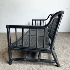 a black metal bed frame sitting on the floor