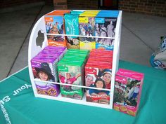 a display case filled with different types of snacks on top of a blue table cloth