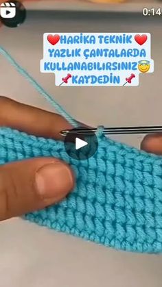 someone is crocheting the stitchs together with their fingers and thumbnails