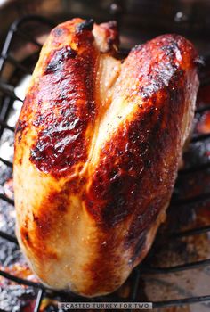 roasted turkey for two on the grill with text overlay