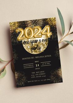 a black and gold new year's eve party card