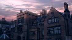 an old building with many windows at dusk