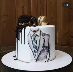 a cake decorated with an image of a man's suit and tie on it