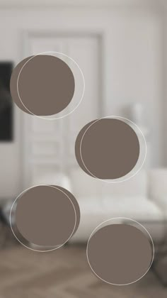 three circles floating in the air over a living room