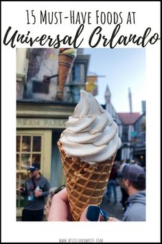 a person holding an ice cream cone with the words 15 must have foods at universal orlando